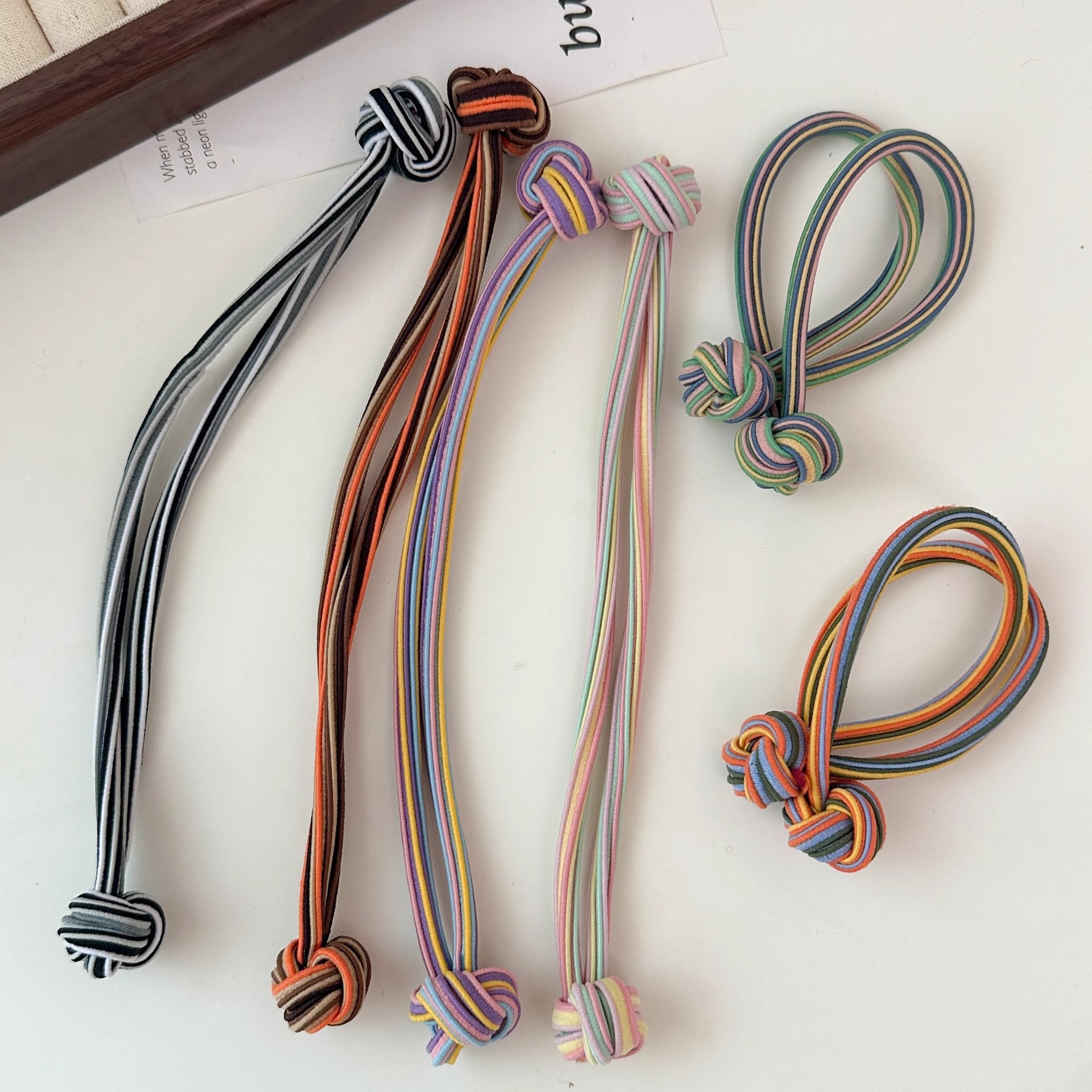 Anillo de cabello de nudo de cola de cabello de alta elasticidad no lesionar cabello de banda de goma roja durable cabello de cola de cabello de mujer al por mayor