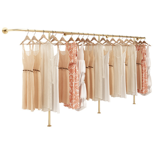 Golden clothing store display rack wall-mounted hanging rods against the wall combination hanging women's clothing store shelves