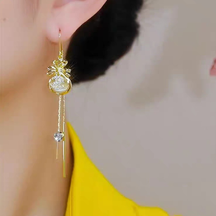 Golden long fashionable elegant small design earrings