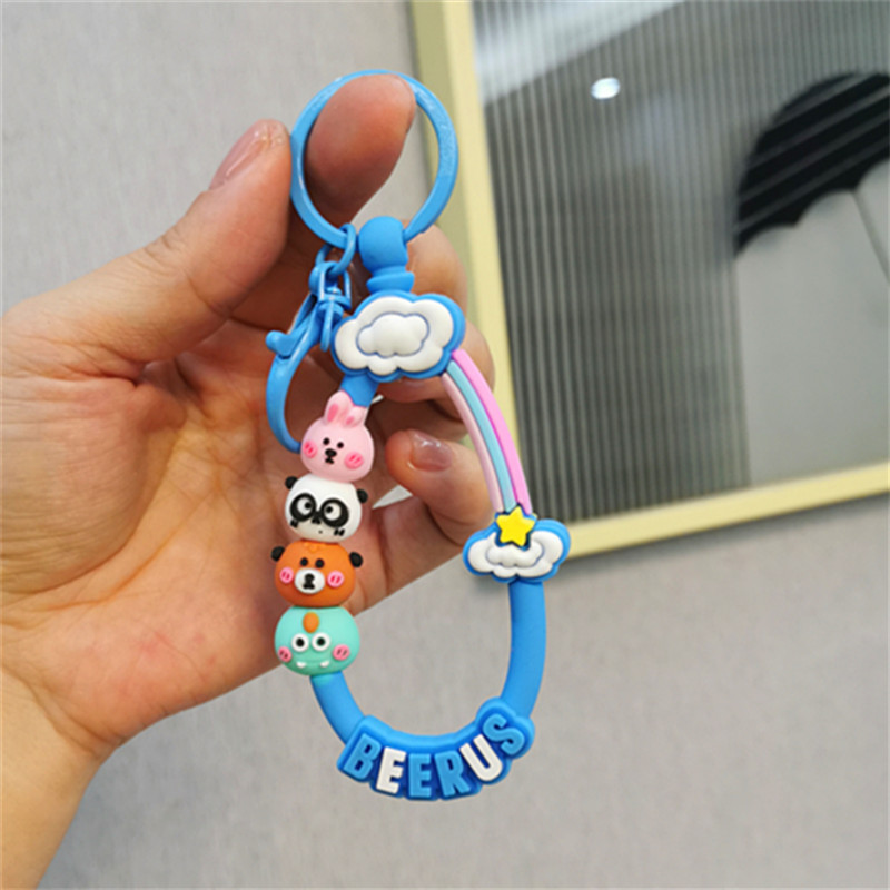 Colorido Berus dibujos animados cuerda Rana conejo llavero colgante Cadena de teléfono móvil fresco color sólido conjunto auriculares