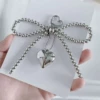 Серебристый, подвеска «сердце» с жемчугом и бантом (сердечная застёжка)