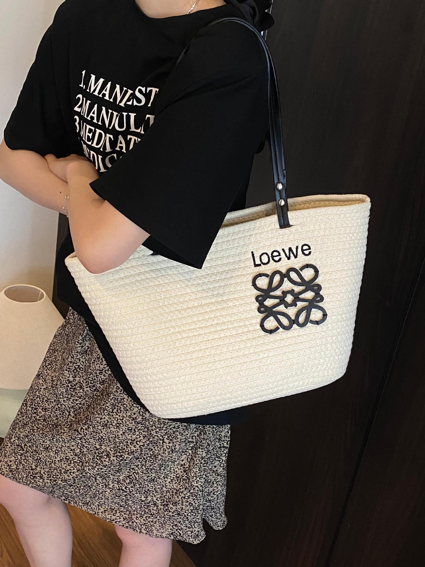 Bolso tejido femenino de gran capacidad 2025 verano nuevo bolso de playa de vacaciones junto al mar estilo de viaje bolso tejido de paja portátil