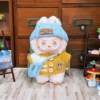 Yellow sweater, blue hat, bag