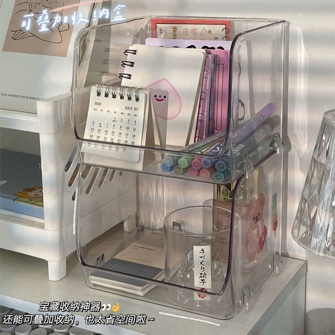 Minimalist transparent stackable dorm desk storage rack for miscellaneous items, facial masks, and skincare products, made of clear acrylic.