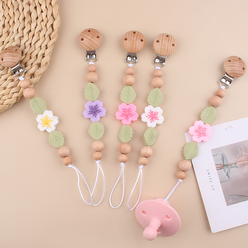 Nuevo clip de chupete de haya para bebés, dibujos animados creativos para bebés, flor de begonia, muerde los dientes, cadena de chupete anti-caída