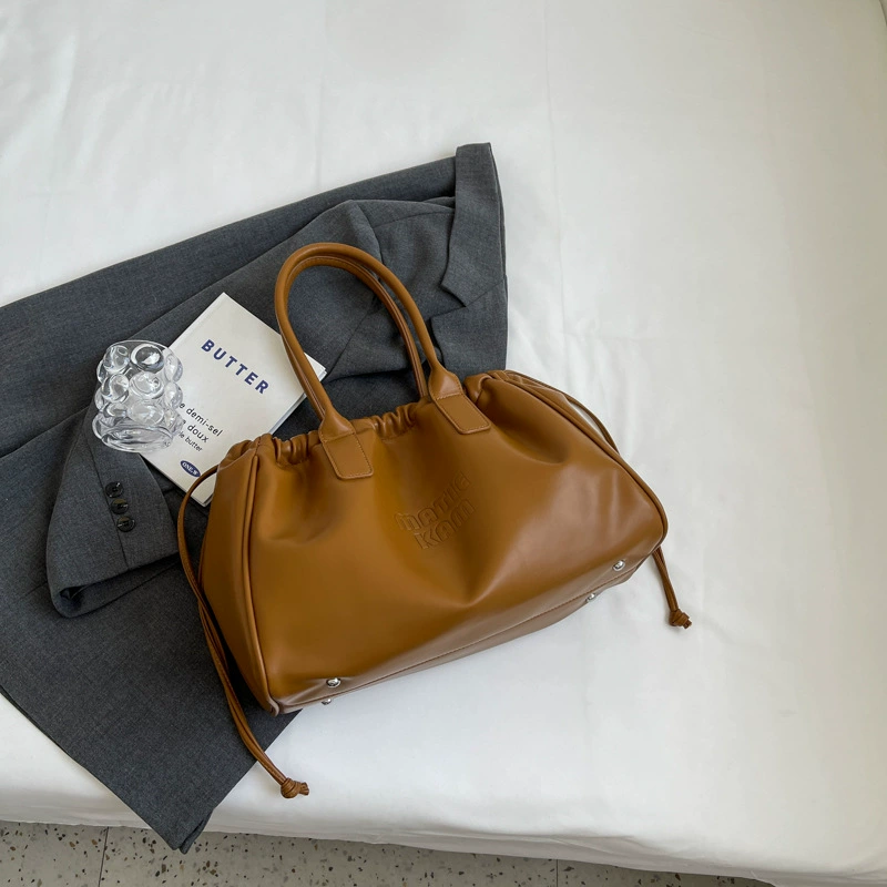 Universal small design shoulder bag, capacious one-shoulder bag, 2023 collection, genuine leather, drawstring