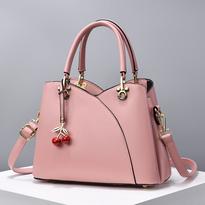 Bolso de mano, bolso de gran capacidad, bolso de 2025 nuevo bolso de mujer de color sólido, bolso de madres, bolso de moda de mediana edad, bolso de mochila versátil