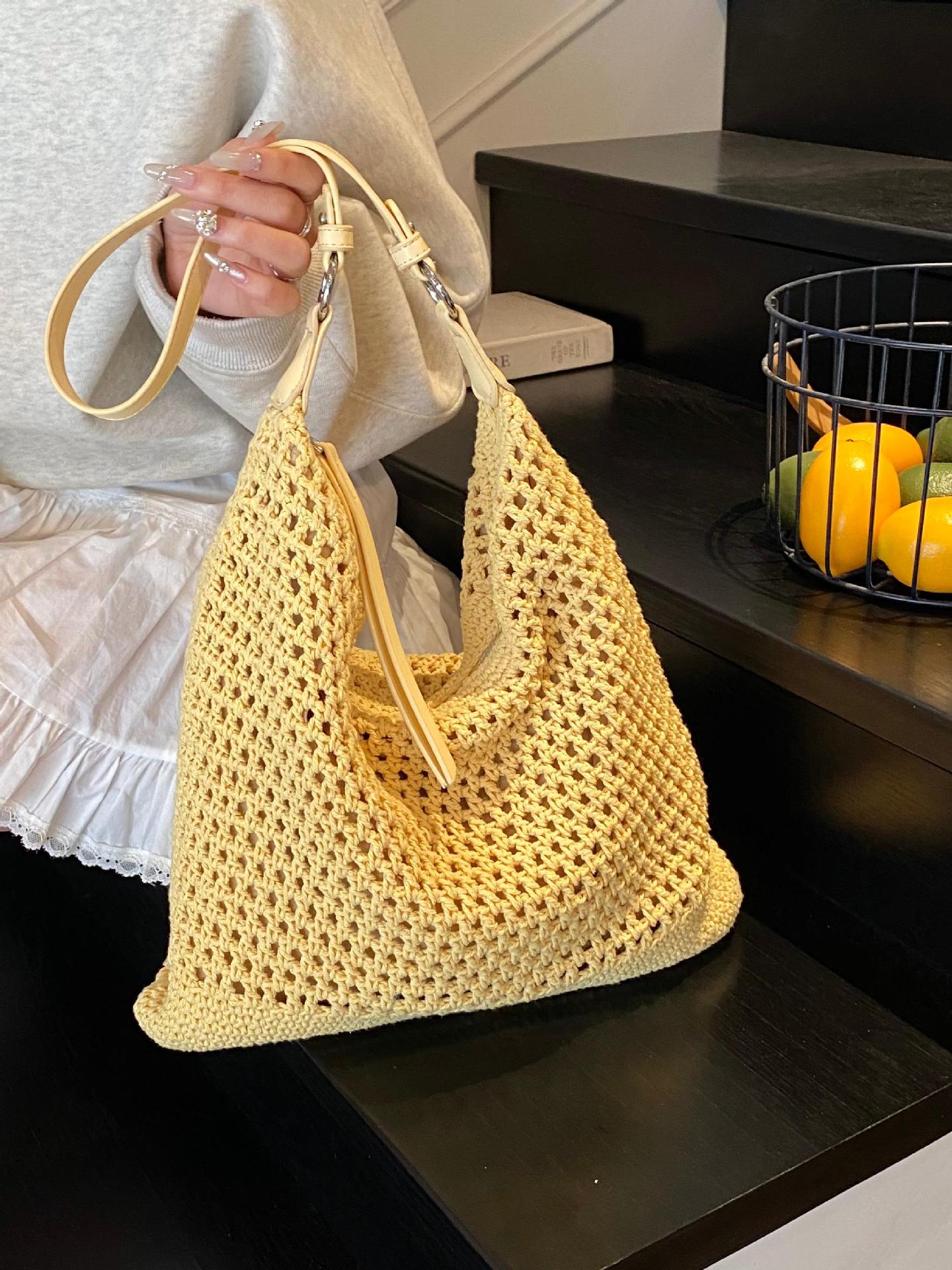 Venta caliente de verano nuevo producto bolsa tejida hueca para mujer 2025 bolsa de playa estilo vacaciones bolsa de paja de gran capacidad bolsa de cubo