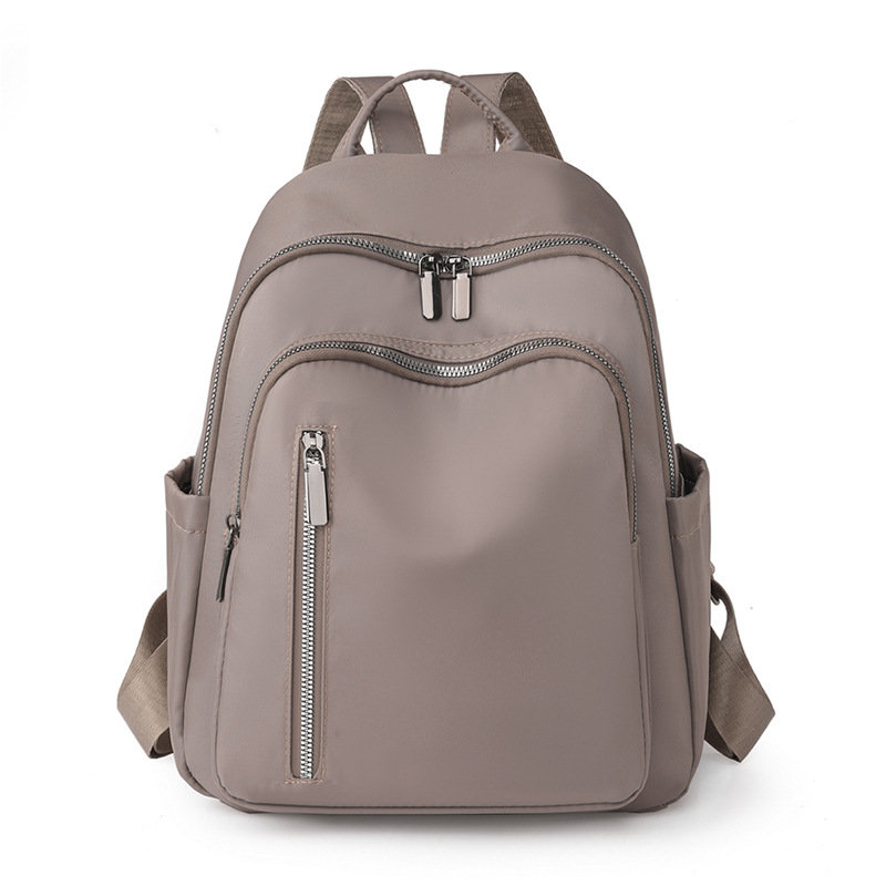 2023 nueva mochila de nailon para mujer coreana, mochila de viaje de gran capacidad para viajeros urbanos de todo fósforo de moda al por mayor