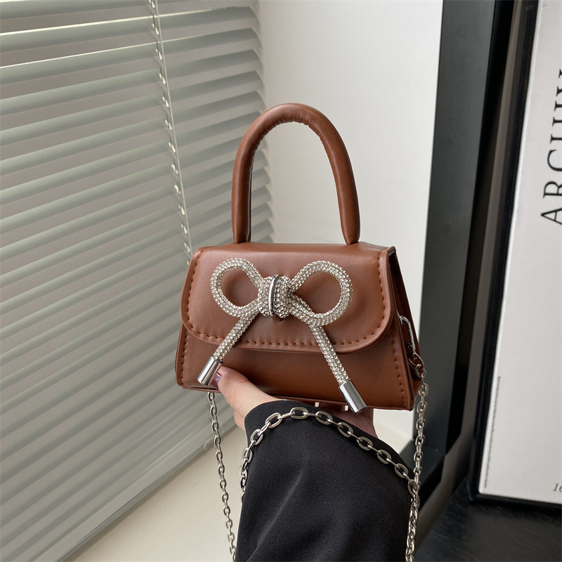 Ins nicho bolso de textura francesa mujer 2025 primavera nuevo arco bolso pequeño bolso de hombro de estilo occidental