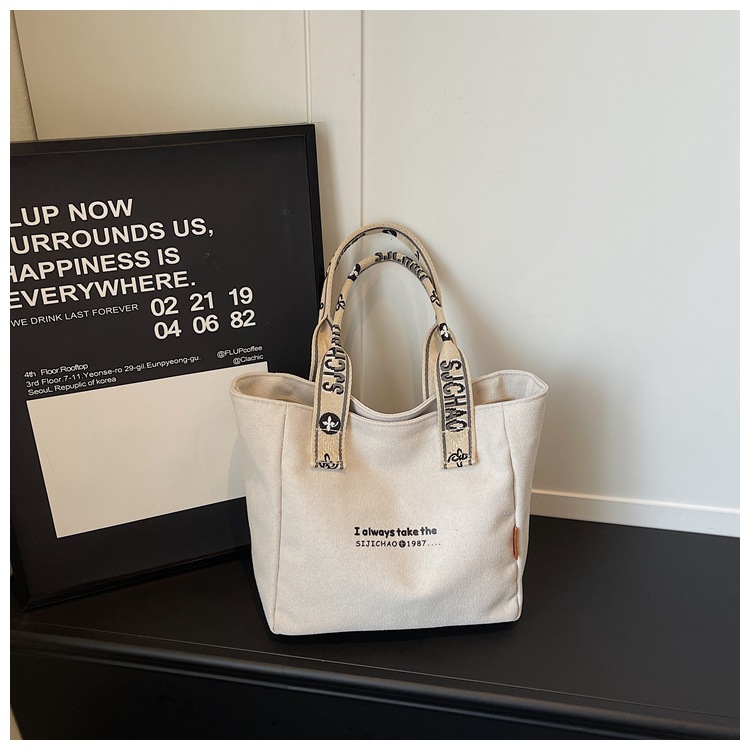 Bolso de lona de gran capacidad para mujeres 2026 verano nuevo bolso de mano ligero y simple para viajar bolso de ocio bolso de mamá