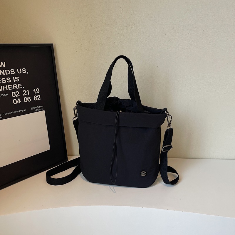 Bolso de lona para mujer 2025 nuevo bolso de cubo ligero y casual bolso de hombro portátil bolso de mensajero deportivo de fitness de gran capacidad