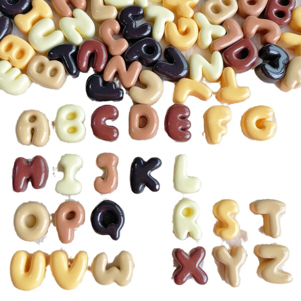 small brown accessories with letters