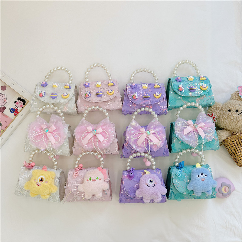 Nueva princesa de dibujos animados bolsos infantiles lindos bolsos de arco de moda chica perla bolsos de hombro
