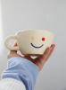 Xinming's new smiley cup hand pinch ceramic cup disc house coffee cup breakfast cup disc dec of the disk set set