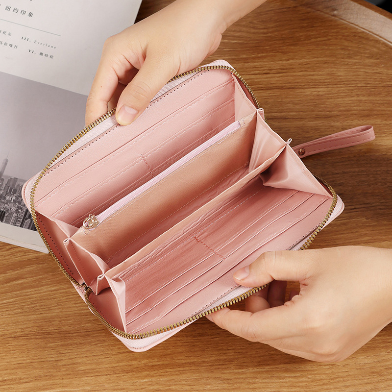 Nueva versión coreana de la billetera larga de damas, billetera de negocios de lujo ligera, moda multi-tarjeta billetera con cremallera al por mayor