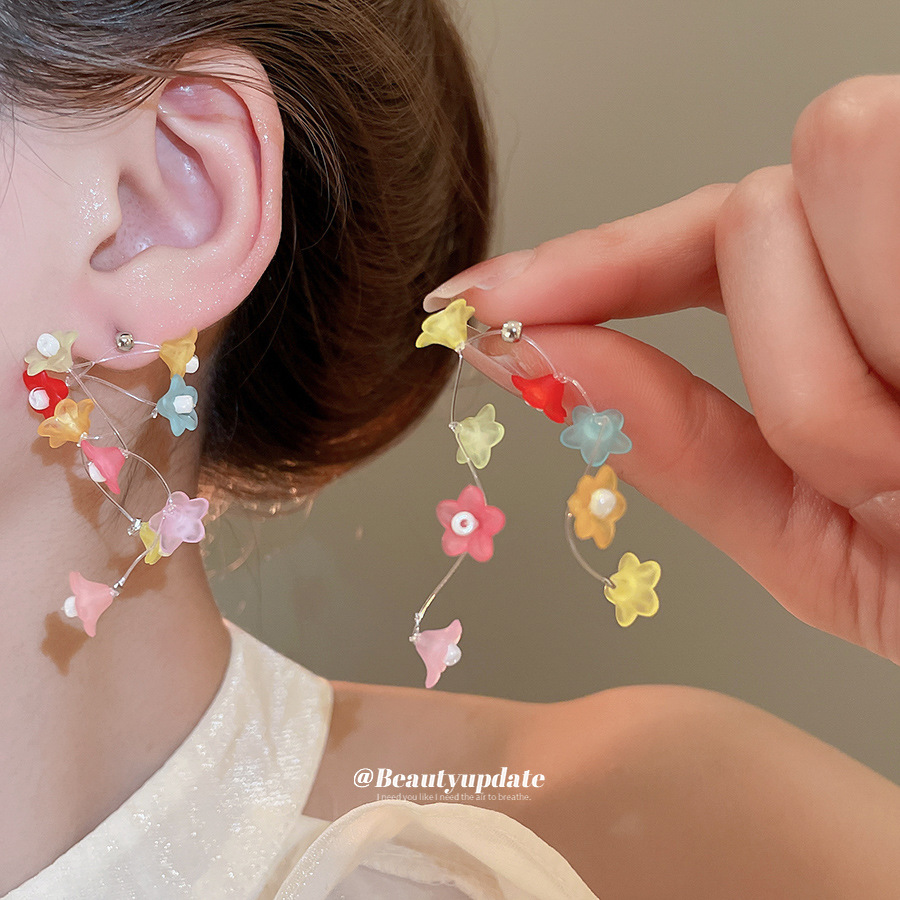 Pendientes de borla de flor de trompeta de color de aguja de plata Pendientes de estilo de vacaciones de verano Pendientes de todo fósforo de moda femenina Sentido de diseño nicho
