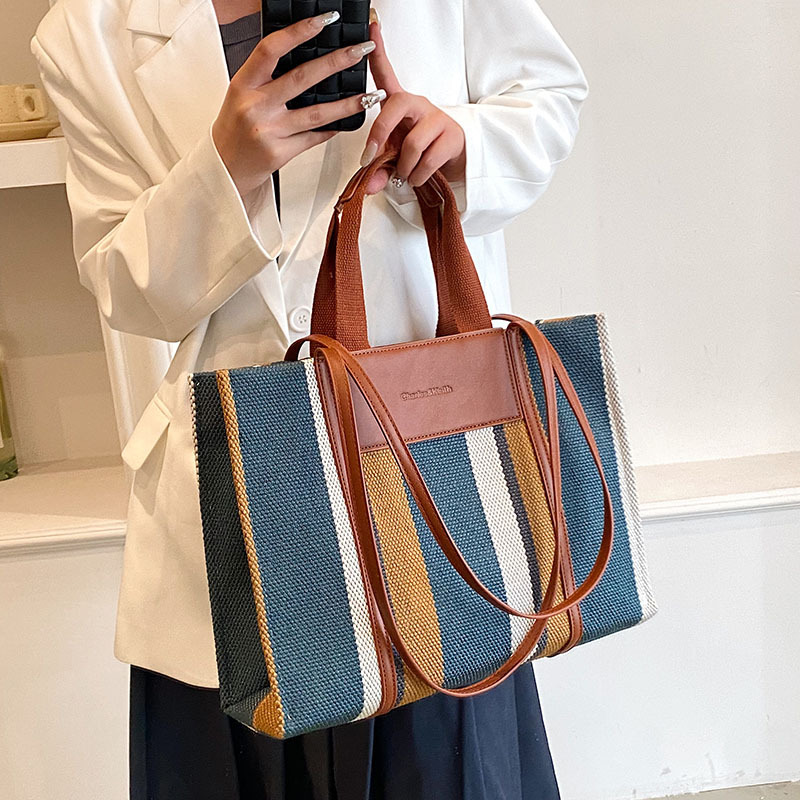 Bolso de mujer nueva línea transfronteriza lienzo color contraste bolso de mano rayas nicho de moda alta moda bolso de hombro
