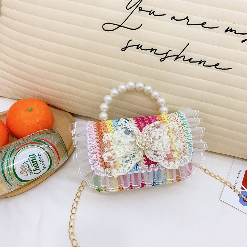2025 nuevo regalo para niñas para niñas jardín de infantes Día de los niños arco de perla tela de paja bolso de hombro
