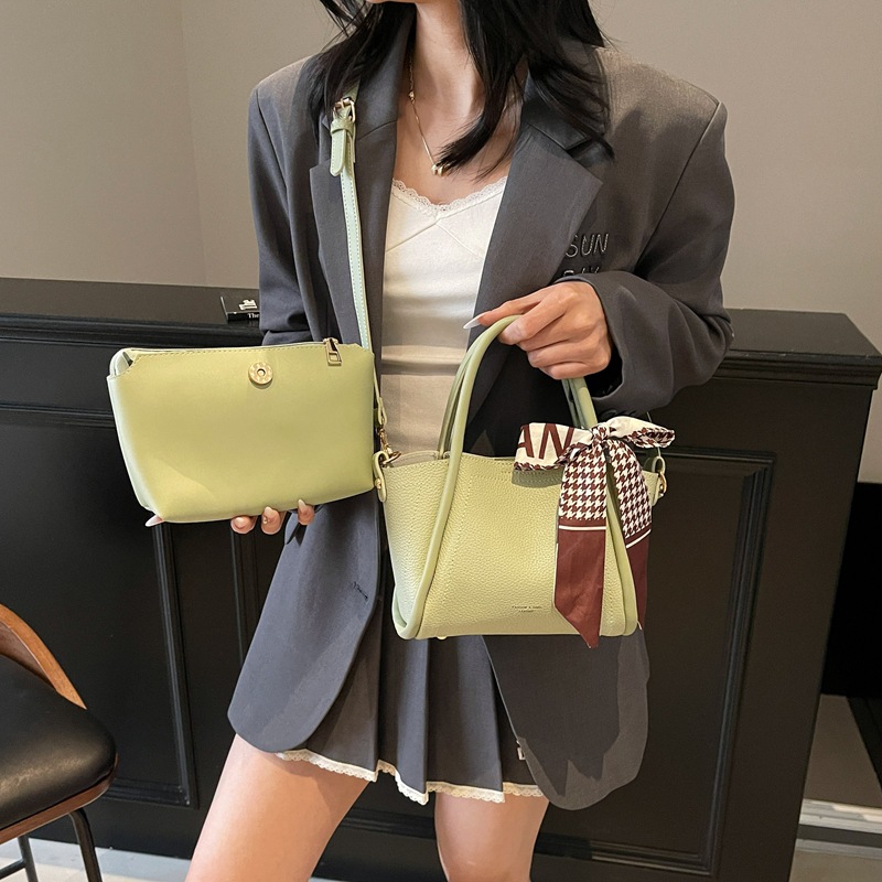 Bolso de cubo con patrón de lichi de alta gama para mujer 2025 nueva tendencia bolso de mensajero de todo fósforo casual bolso de cubo hembra portátil