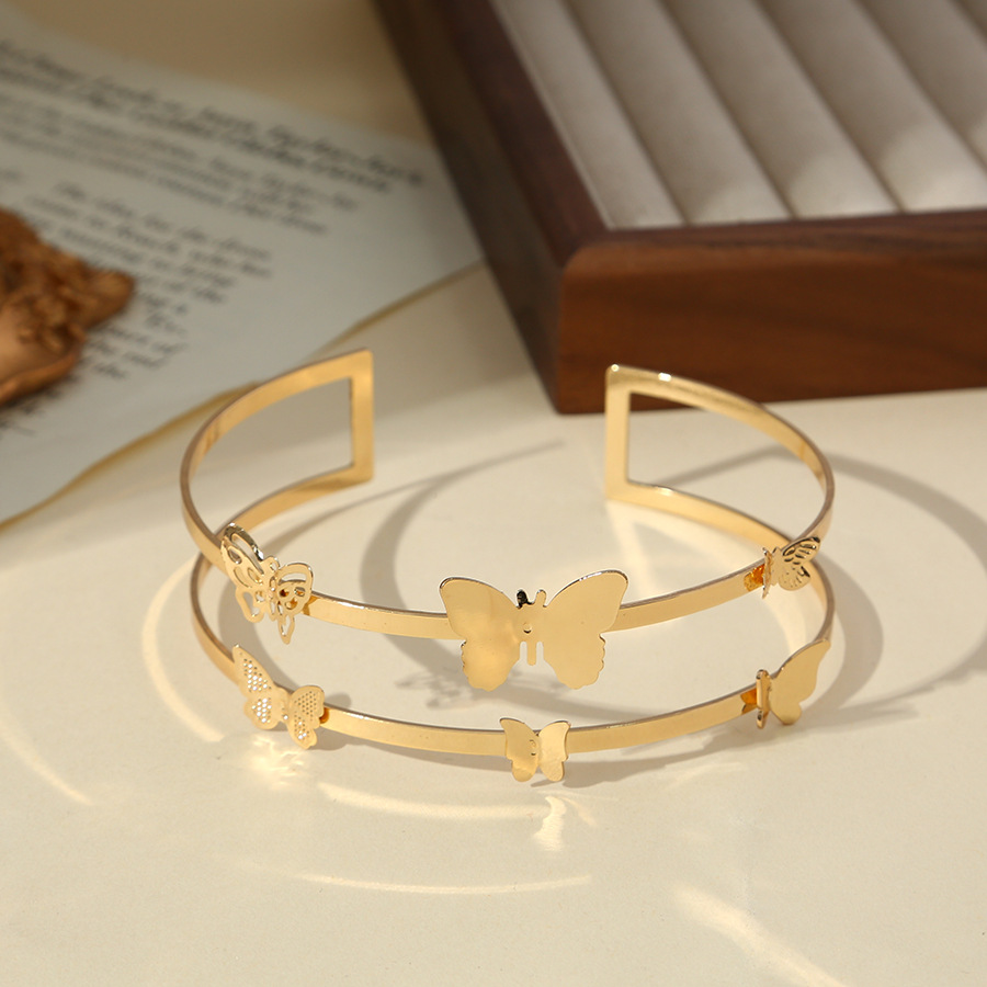 Amazon suministro directo pulsera de moda europea y americana simple anillo de brazo hueco mariposa brillante metal geométrico pulsera de brazo personalizada