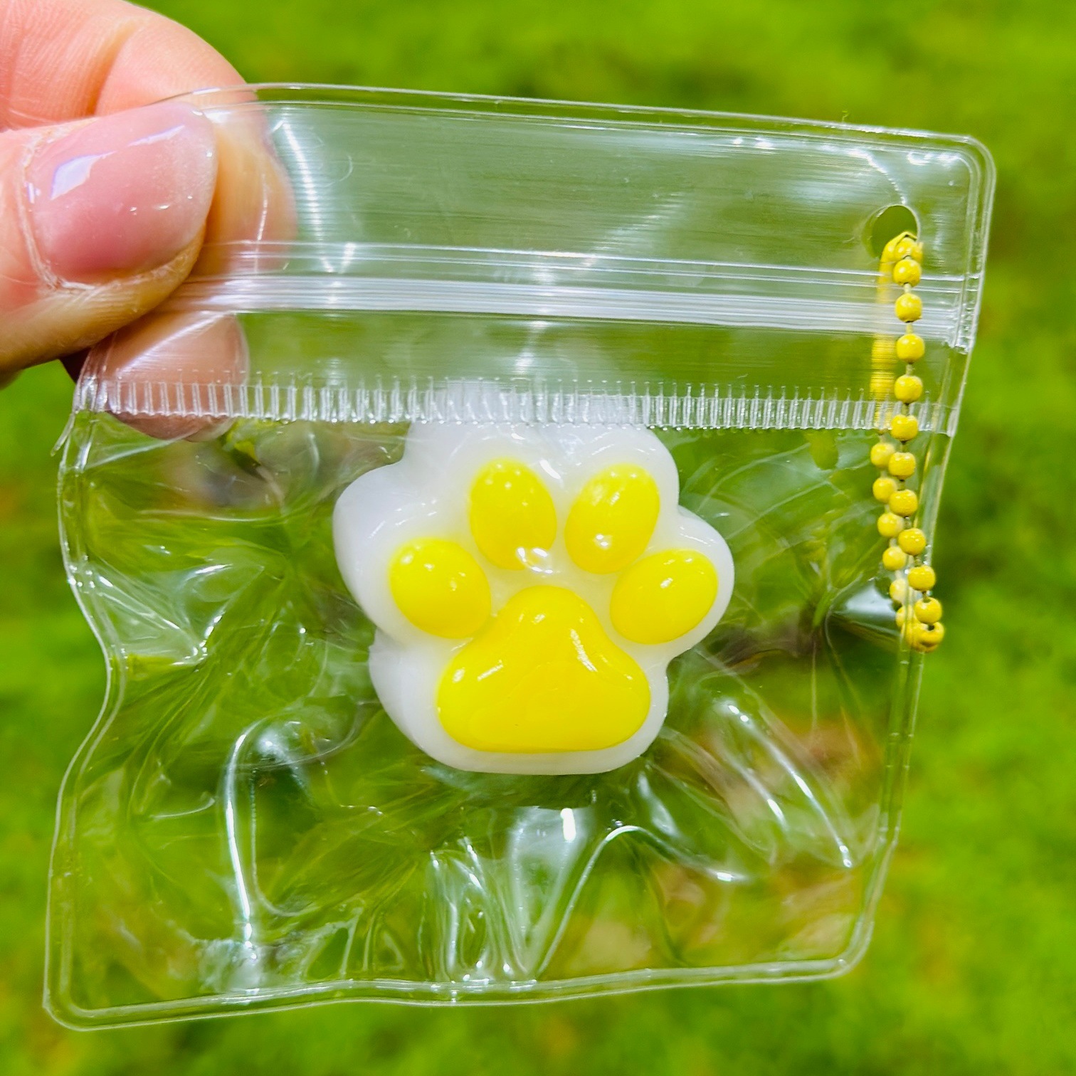 Small nose with yellow claws on white background