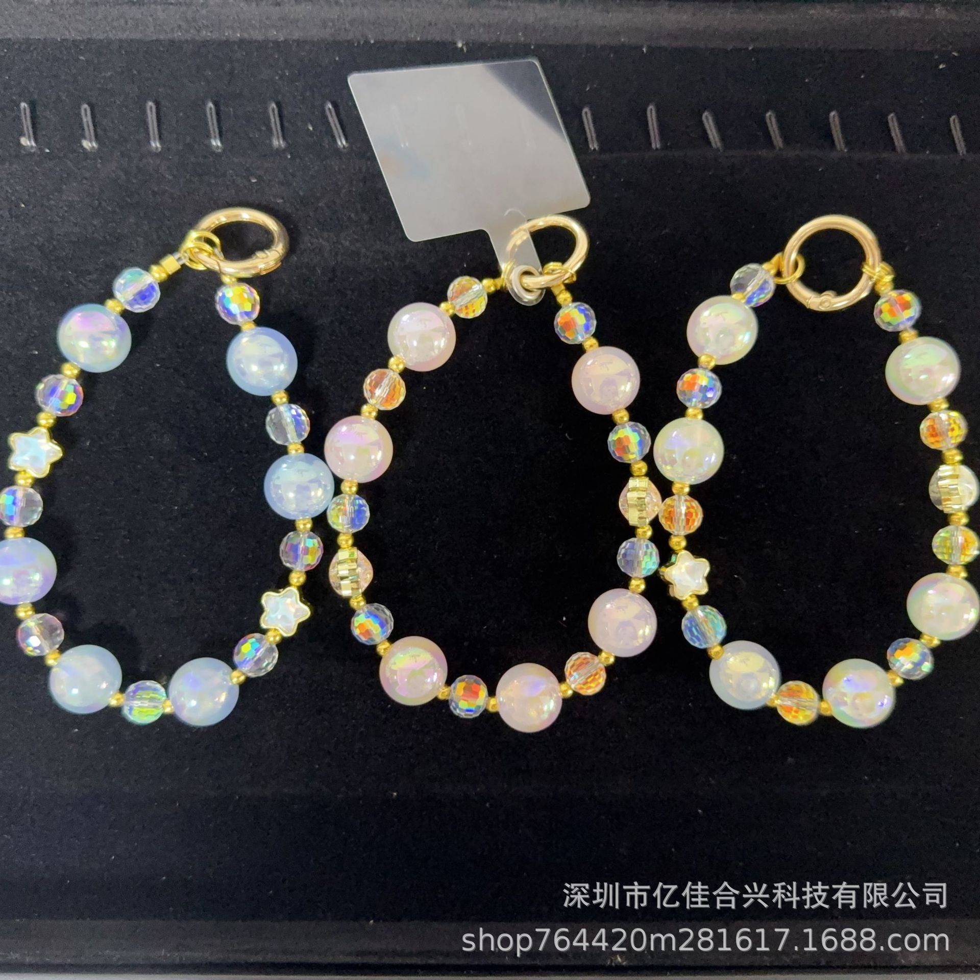 Mayorista cadena de teléfonos móviles sensación de alta calidad estereoscópica bola pentagonal llave colgante perla de teléfono móvil colgante pulsera nuevo