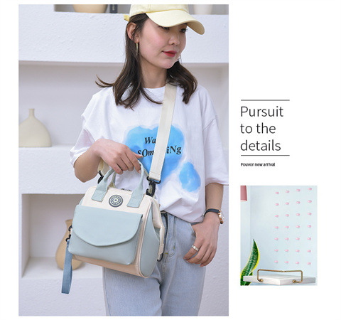 The Mommy bag is small and cute. It has a detachable front pocket and is a multi-functional baby bag. It is waterproof, lightweight, and has a crossbody design. It can be used to carry milk bags undefined