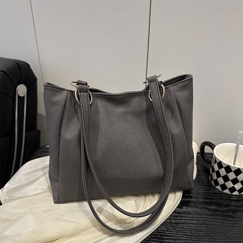 Bolsa de textura para mujeres de gran capacidad 2025 nueva primavera y verano ocio rayas bolsas de compras de hombro para clase de viaje bolsa