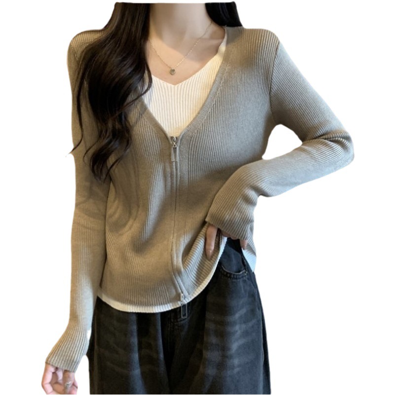 2023 Primavera y Otoño nuevo falso de dos piezas con cuello en V de manga larga de punto exterior de punto superior de las mujeres de la cremallera de moda suéter fino