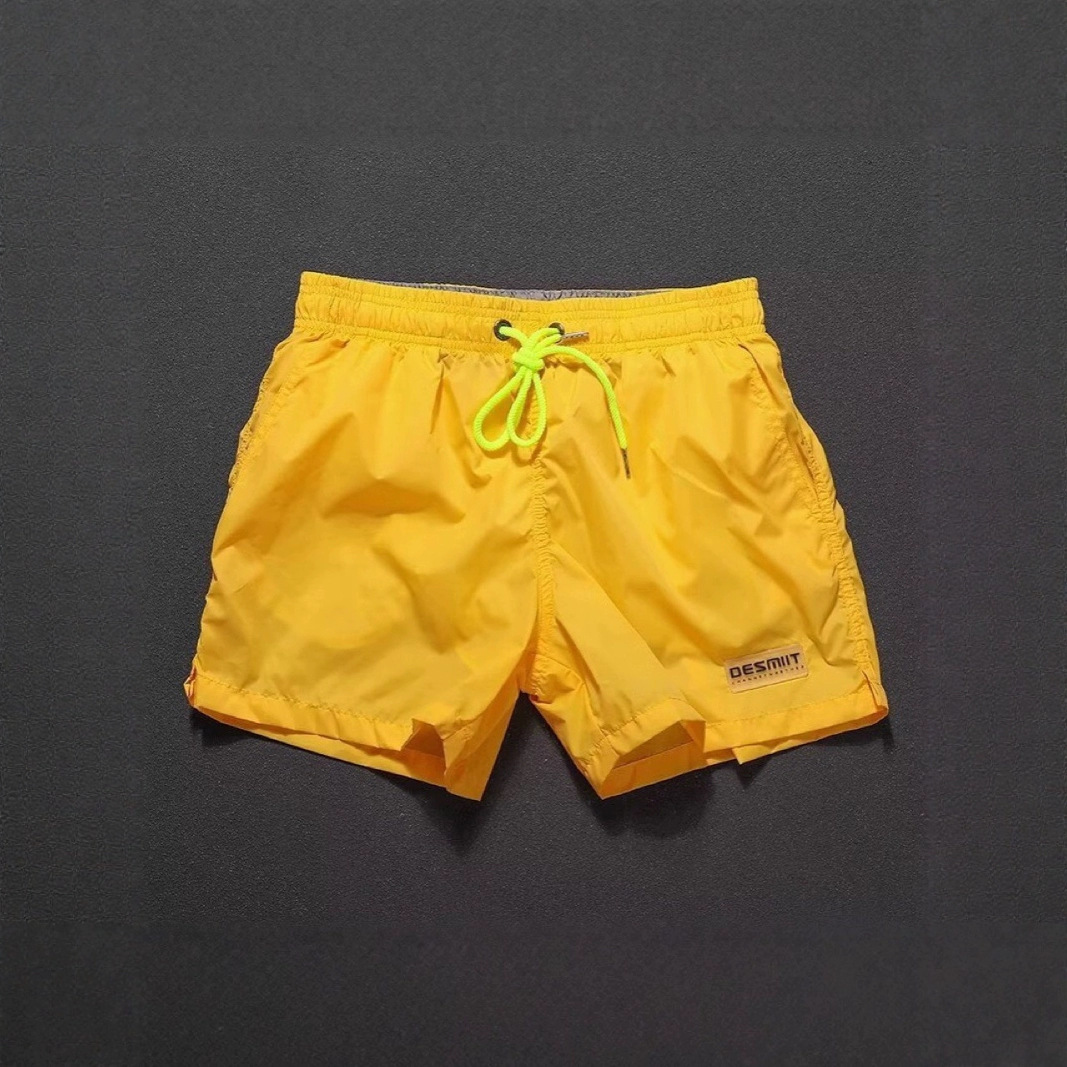 2025 nuevos pantalones cortos casuales para hombres, colores sólidos, simples y neutrales, pantalones de playa impermeables, pantalones de tres puntos de secado rápido para hombres