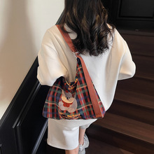 原创设计插画包包女2025春夏新款帆布时尚潮流格子托特包通勤大包