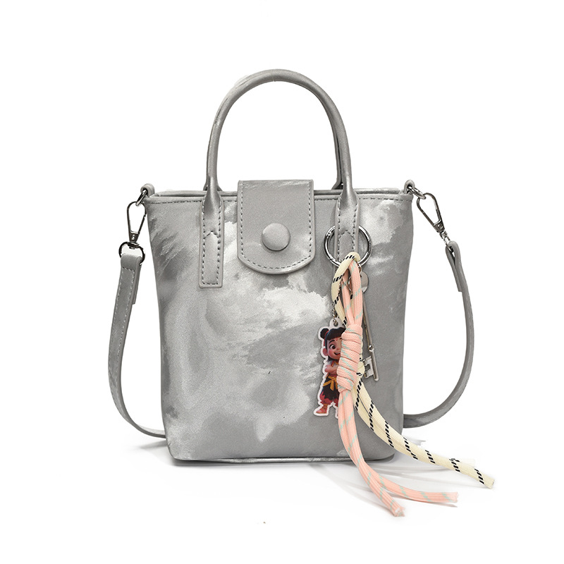 Verano super caliente mini bolso de mano para mujeres 2025 nueva moda bolso de balde de moda explosión de textura universal mochila