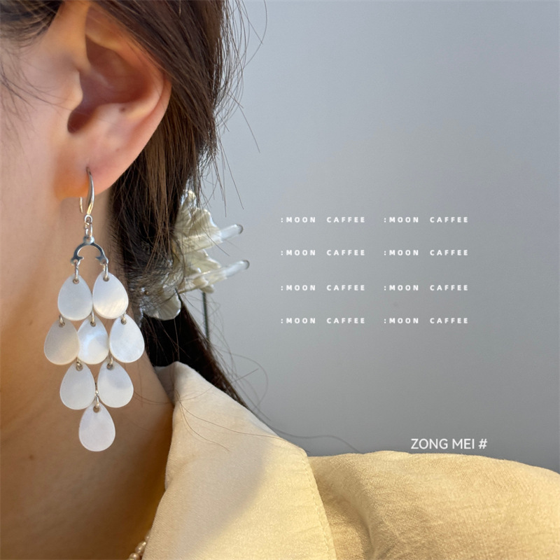 organic elegant long universal earrings drop-shaped with tassels…
