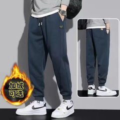 男性のベルベットのズボンの純色の束の足のカジュアルなズボンの春秋の新型の快適なつなぎ合わせのスポーツズボンのズボン