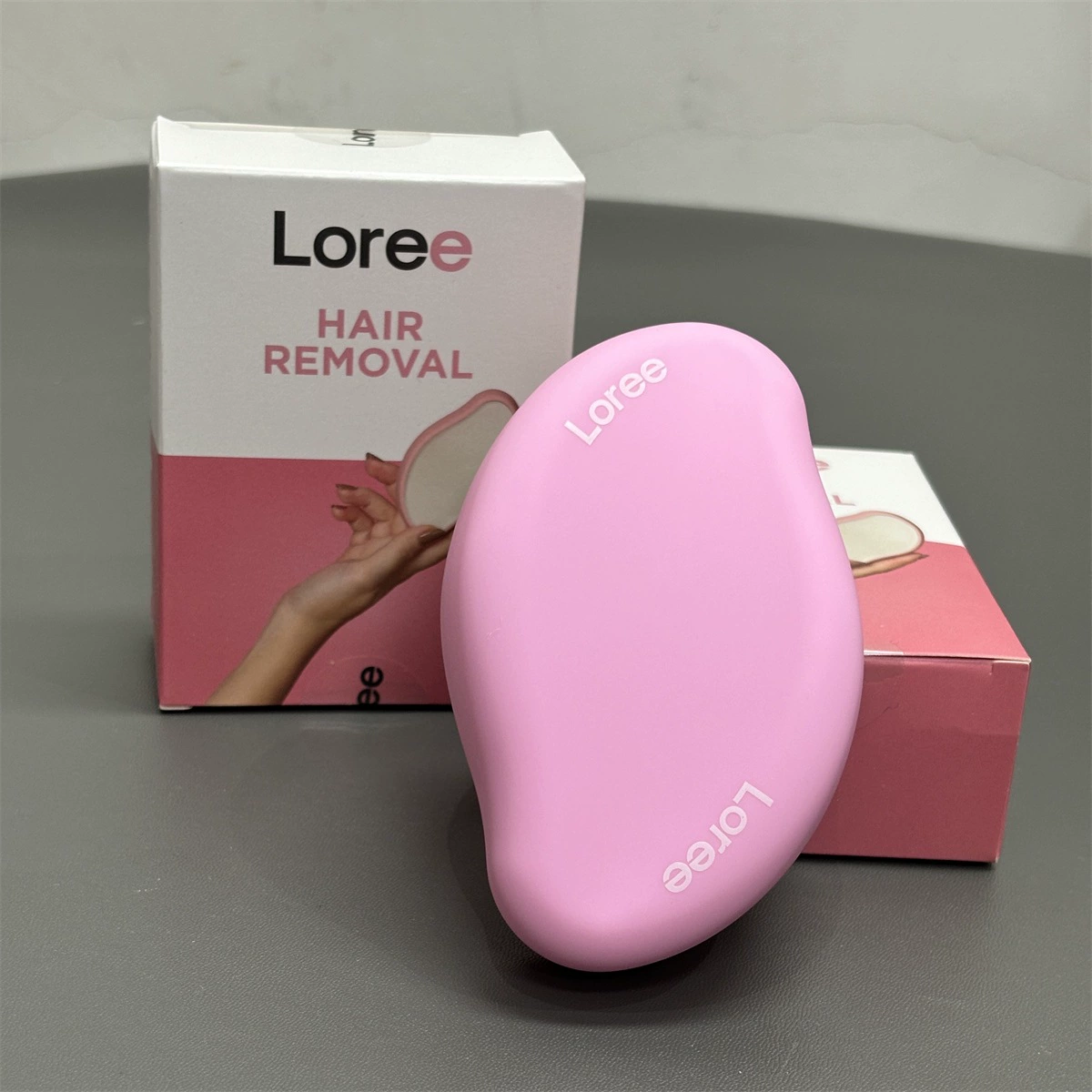 Epilator (Loree) handheld hair removal and exfoliation tool, compact ergonomic design