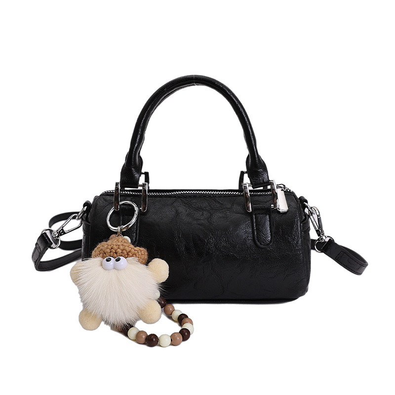 Nicho de diseño retro bolso de mano mujer 2026 primavera nuevo bolso de hombro sensación diaria de moda oblicuo bolso cilíndrico