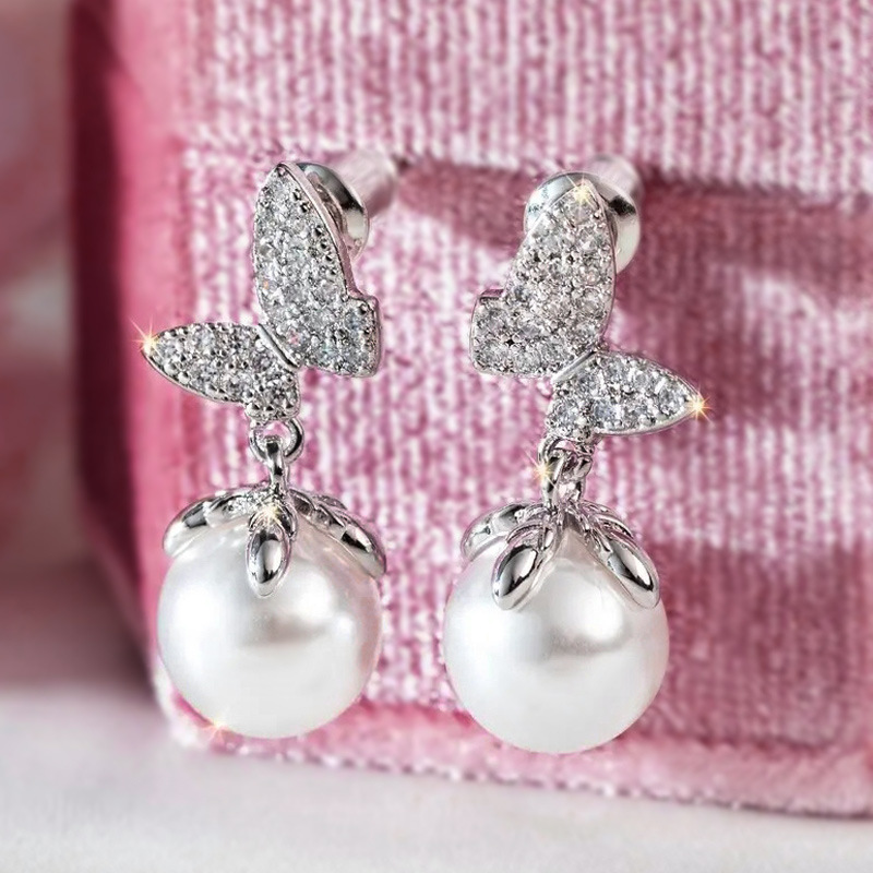 Cao Shi's minimalist pearl butterfly love puzzle, sunset matching drainage earrings, Korean style earrings_voghion.com