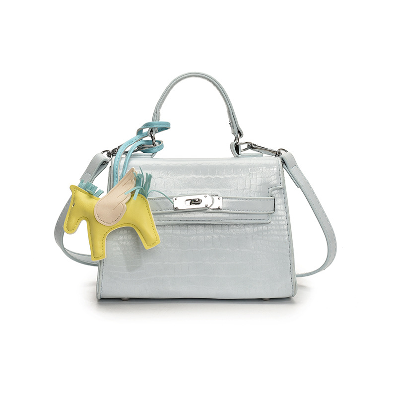 Bolso Kelly de mano de alta gama para mujer 2025 nueva moda casual bolso de hombro con patrón de piedra moda bolso de mensajero de color sólido