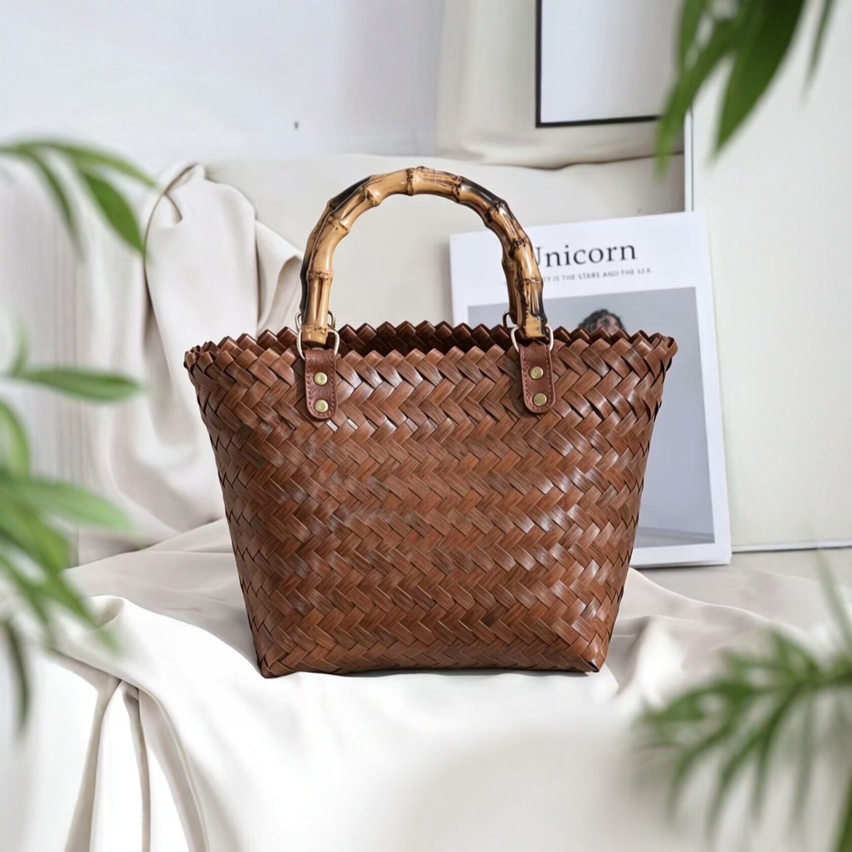 Retro-style woven tote bag with a bamboo handle, resembling a rattan basket, a large-capacity beach or vacation bag for women