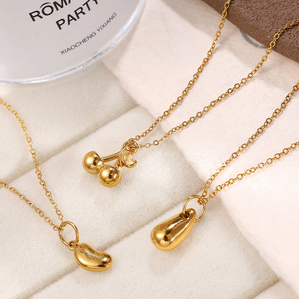 Accesorios de joyería transfronterizos europeos y americanos colgante tridimensional de simulación colgante en forma de corazón de pingüino cereza colgante de collar casero de bricolaje