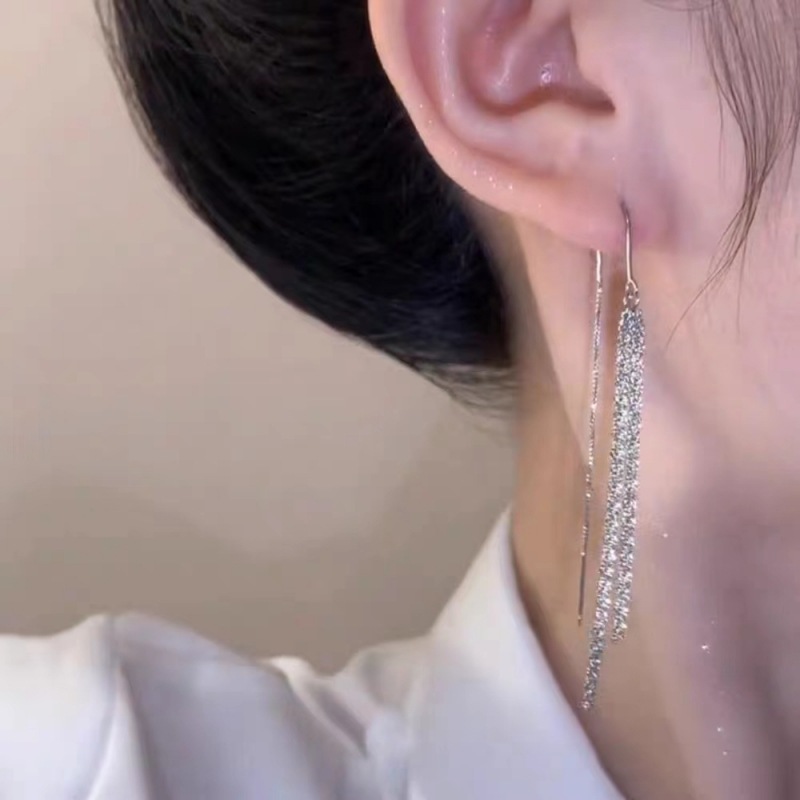 Brillante aretes de tetas de estrellas 2024 nueva personalidad temperamento de alta sensación de aretes largos tirando de aretes explosivos