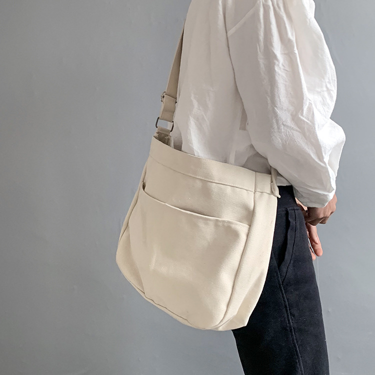 2024 nuevo estilo estilo estilo perezoso bolso de lona de mensajero de color sólido en blanco bolso escolar de estudiante bolso de hombro de estilo universitario ins