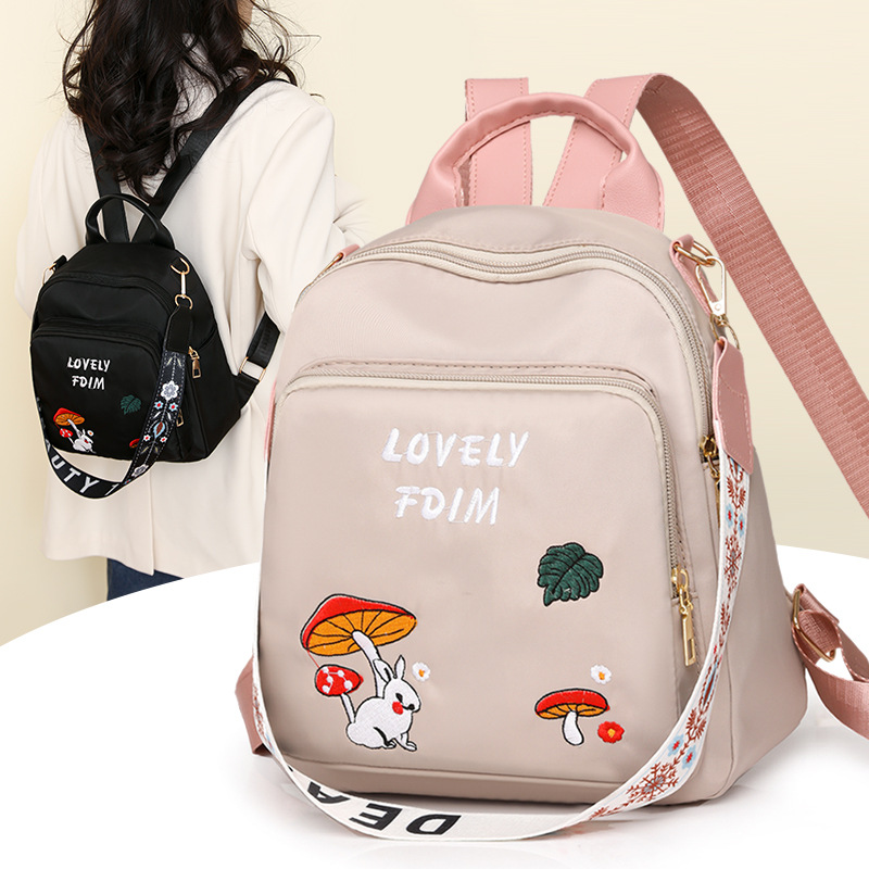 Bolsos para mujer 2025 nuevo estilo casual de dibujos animados para mujer mochila simple y versátil para viajes ligeros mochila de gran capacidad para mujer