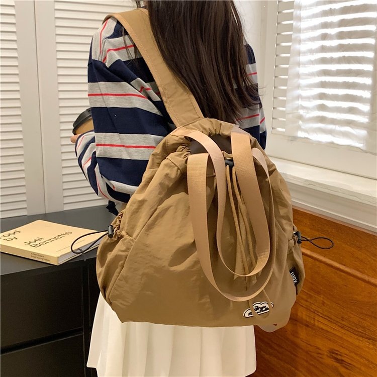 Drawstring backpack for women, sports waterproof nylon shoulder bag, large-capacity commuter bag for fitness and yoga