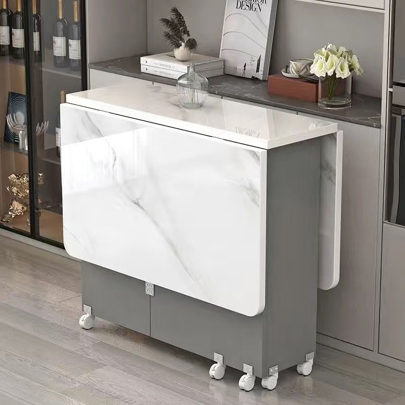 Mesa de comedor redonda simple y plegable tipo pequeño hogar con ruedas móviles simple y rectangular mesa de comedor multifuncional