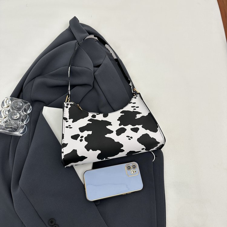 2024 nuevo bolso de axila con estampado de leopardo de moda popular de todos los partidos Bolso de hombro portátil para mujer casual retro europeo y americano