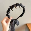 Black ribbon (headband style) about 51cm