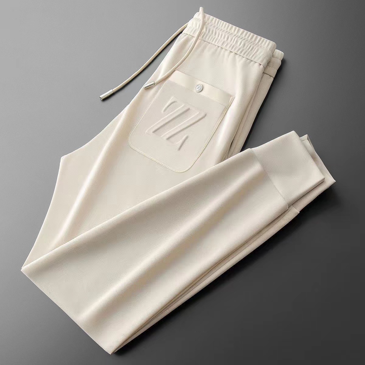 Herrenbekleidung Freizeithosen für Männer dünne Strickstickerei gepresster Kleber dreidimensionaler Modetrend All-Match-Sport-Slim-Fit-Jogginghose für Männer_voghion.com