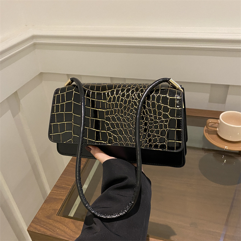 2025 primavera nuevo color sólido temperamento cocodrilo bolso de mano bolso de hombro de moda moda moda elegante bolso de mujer debajo de las axilas